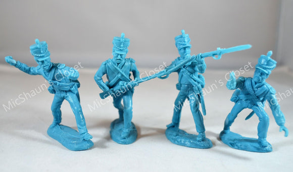 closeup of four blue plastic TSSD Mexican Alamo toy soldiers